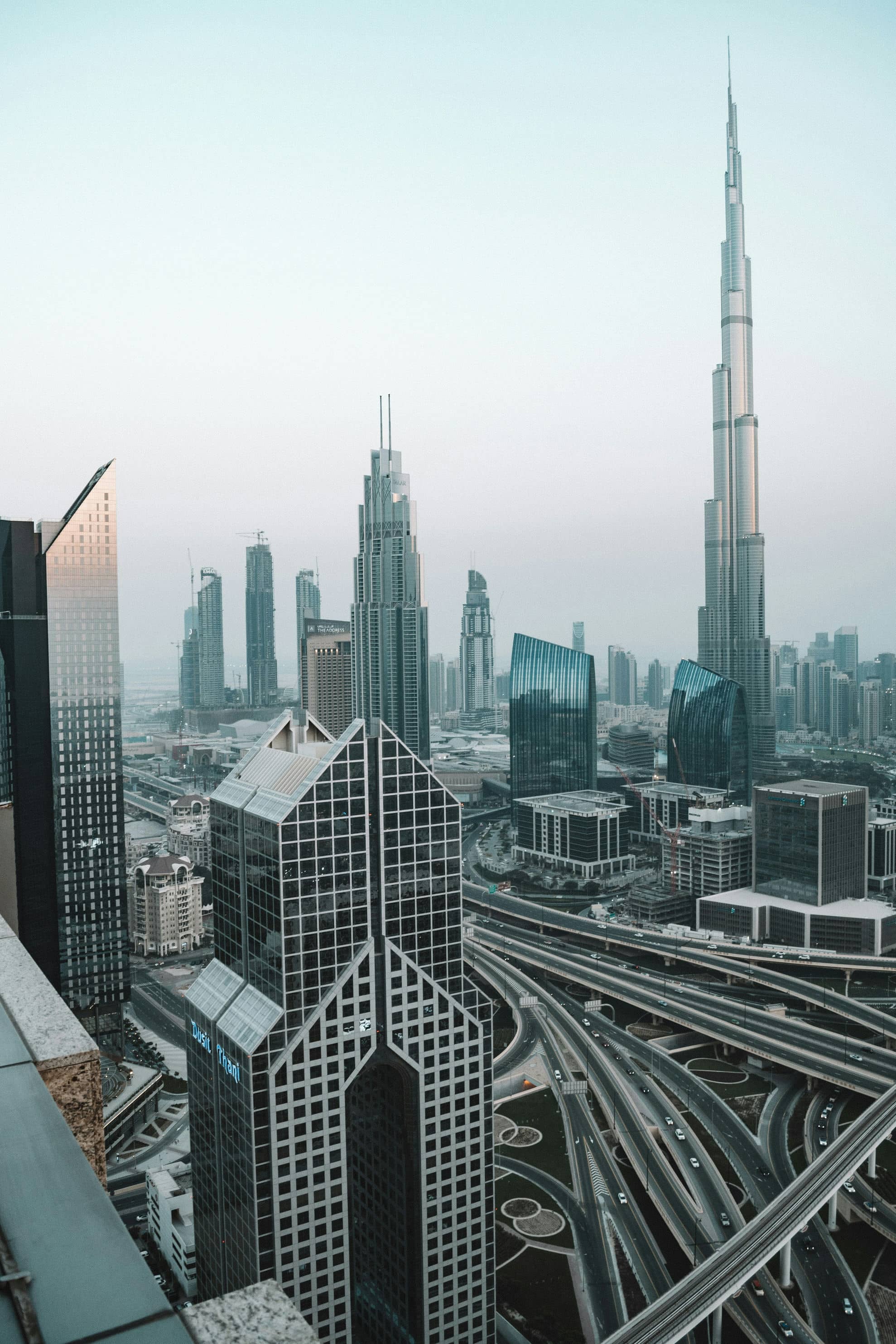 Burj Khalifa and the skyscrapers of Downtown Dubai under a blue sky
